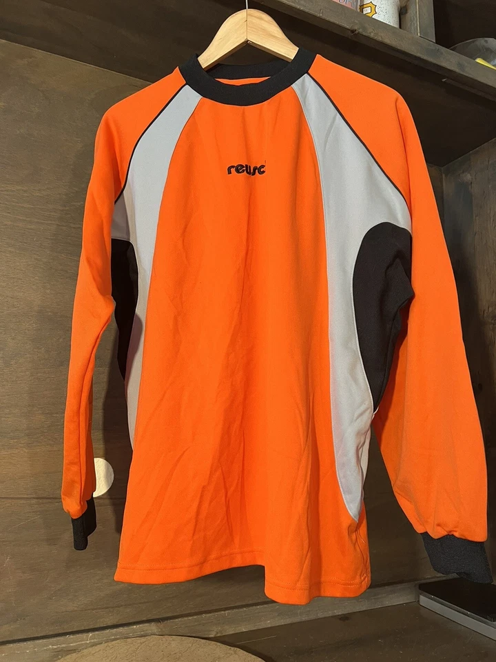 CAMISA DE COMPRESIÓN REUSCH ADULTO BRAZOS ACOLCHADOS TALLA PEQUEÑA NARANJA GRIS NEGRO USADA EN EXCELENTE ESTADO Foto 2 de 4