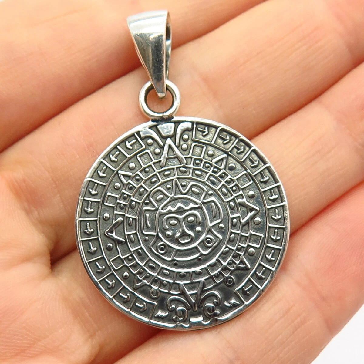 Silver aztec pendant deals