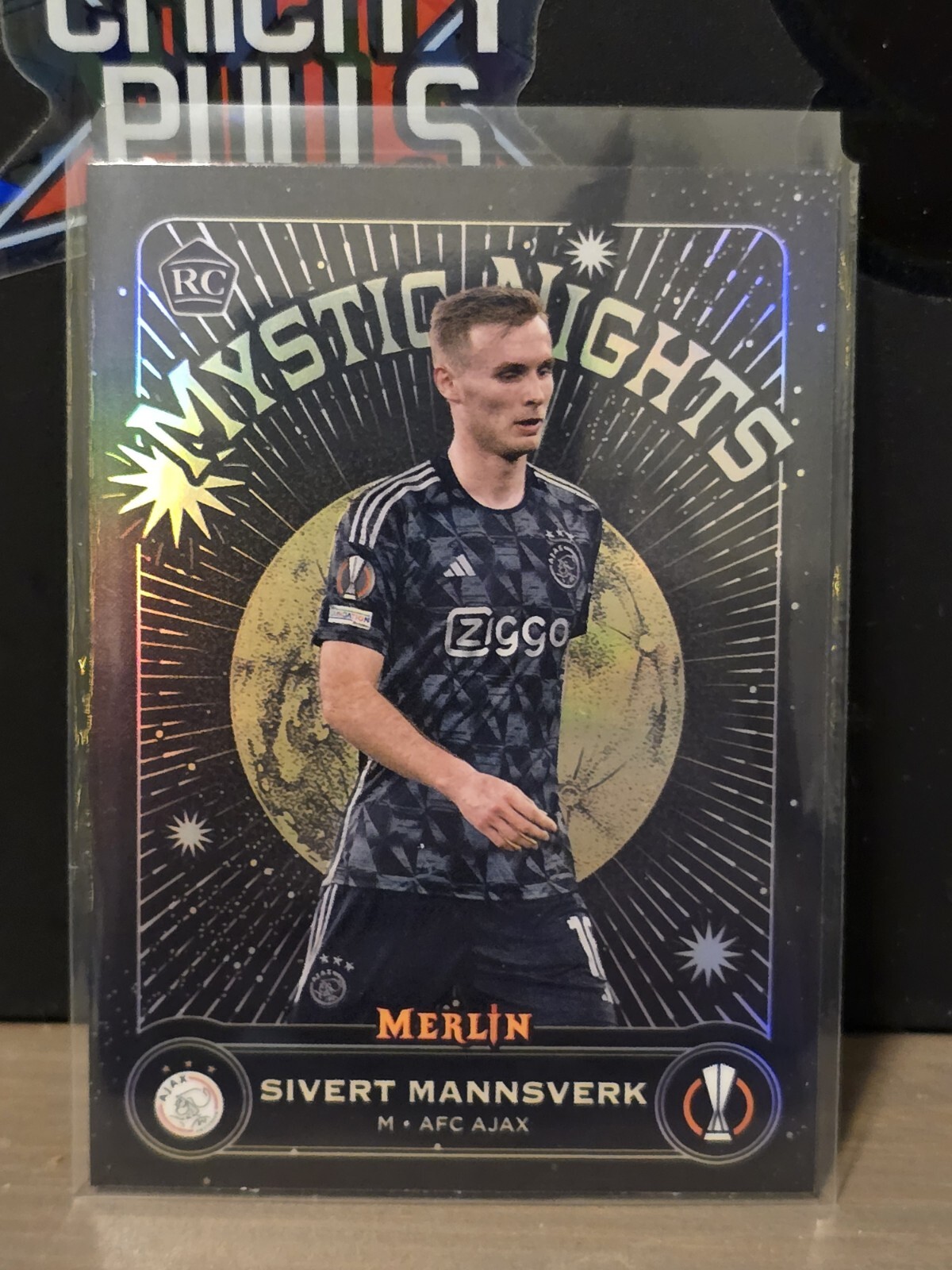 2023-24 Topps Merlin Chrome Mystic Nights #MN-10 Sivert Mannsverk AFC Ajax