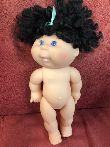cabbage patch doll with black curly hair