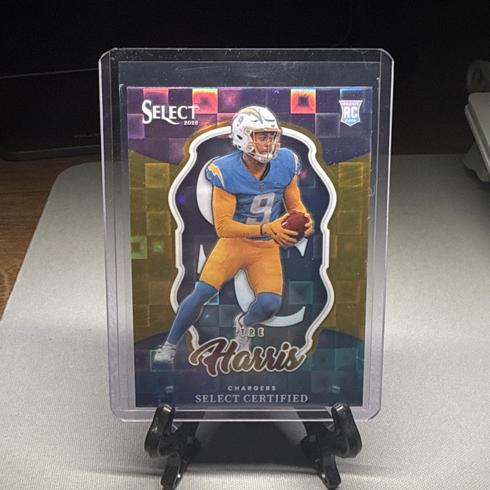 2025 Panini Select #23 Tre Harris Select Certified Rookies Gold Prizm #/10