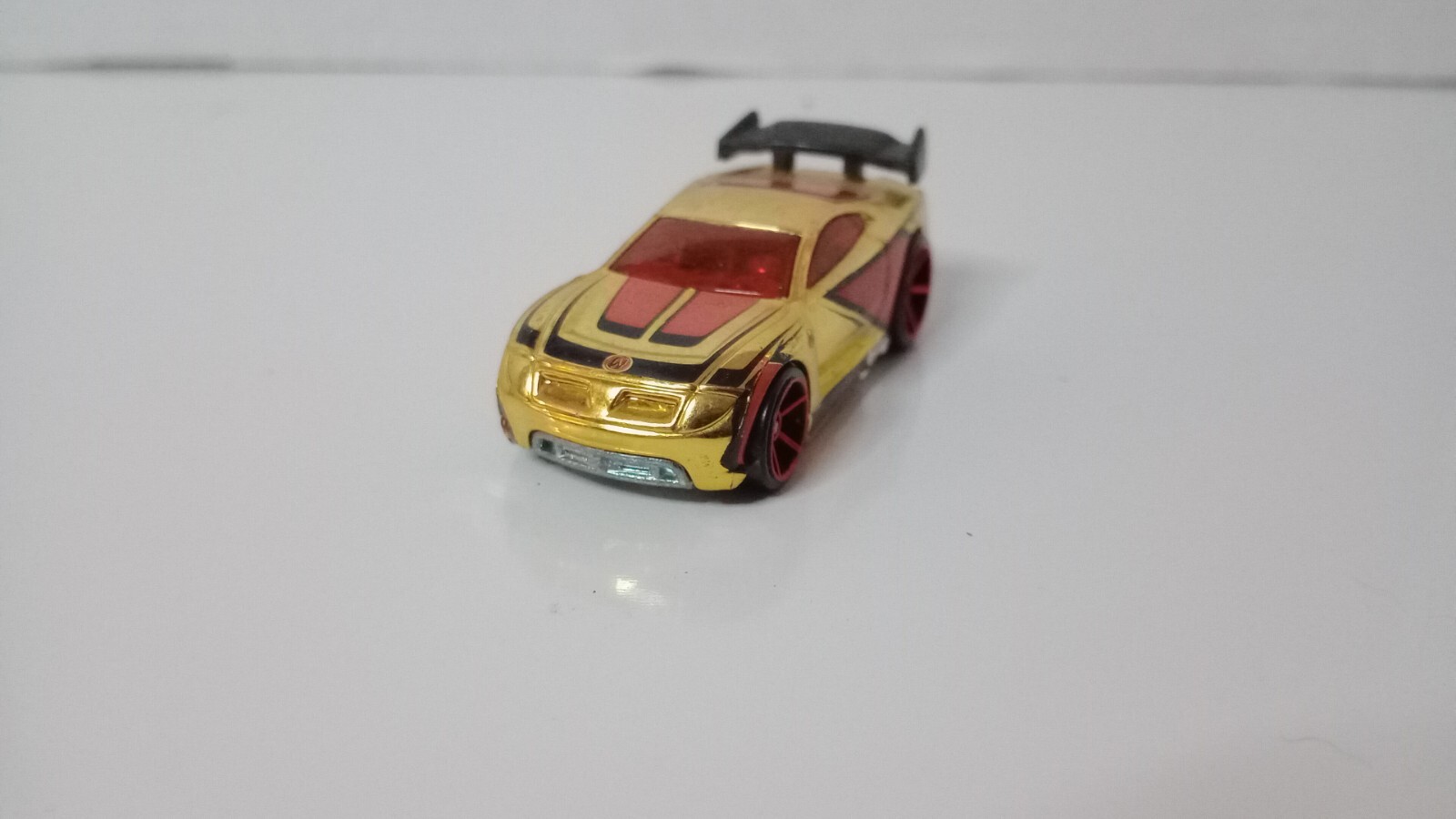 Hot Wheels 2007 mystery car POWER RAGE  gold chrome with red & black