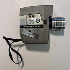 The Revere Model 118D Eye Matic 8mm Movie Camera Power Zoom Telephoto Wide Angle