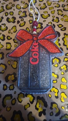 Diet Coke car freshie.  SCENT: CASHMERE SUGARED VANILLA