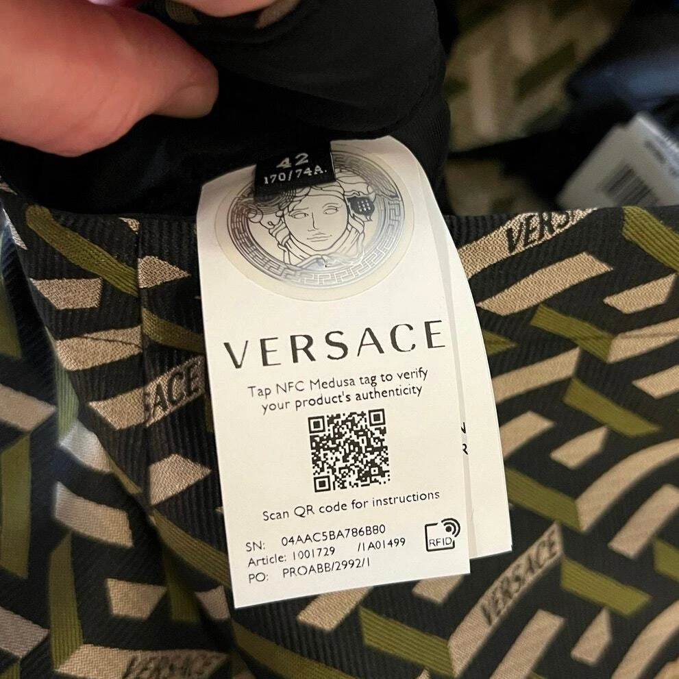 Pantalone jacquard Versace nero e kaki monogramma nuovo con etichetta taglia 42 M