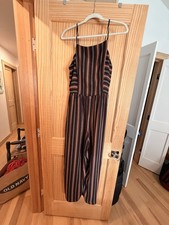 Womens jumpsuit Medium, full length. Black with stripes.