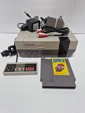 NES Nintendo Console and Super Mario 3. 1 Controller and the Cables.