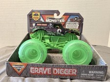 Neumáticos iluminados Monster Jam GRAVE DIGGER escala 1:43 Spin Master - caja rasgadura trasera