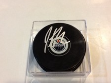 Justin Schultz Signed Edmonton Oilers Hockey Puck Autographed b