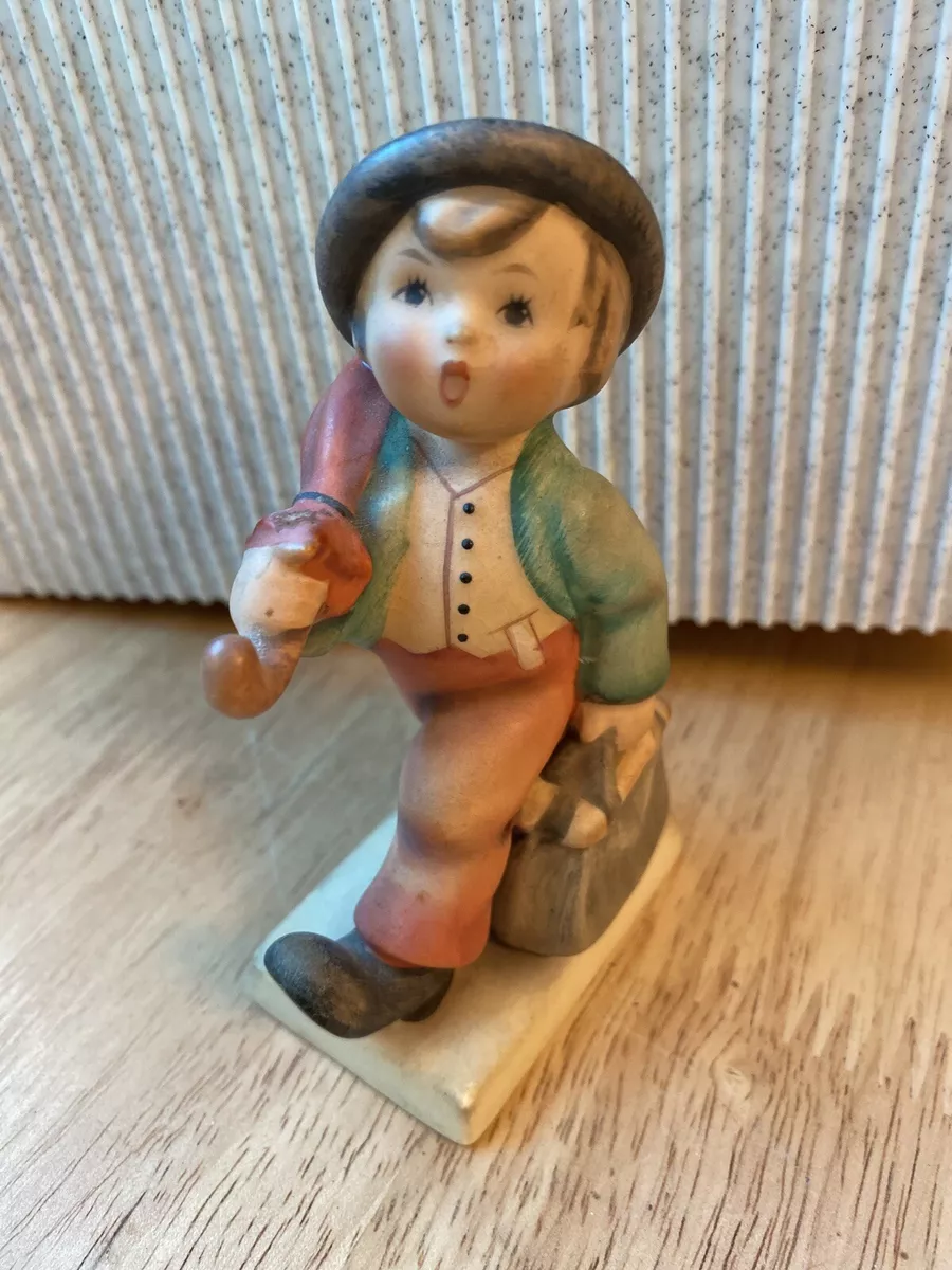 Hummel boy with umbrella on sale and suitcase
