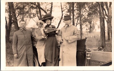 RPPC  1920 s Group Of People Waving Wilson pennant. College, PA ?   (132)