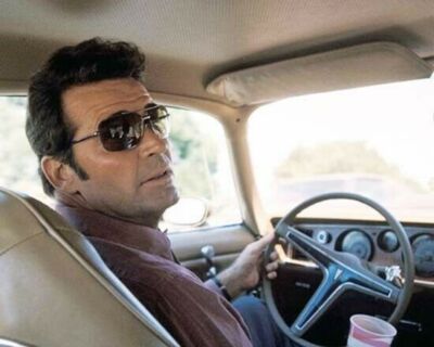 James Garner at wheel of his Firebird wearing sunglasses The Rockford Files 8x10