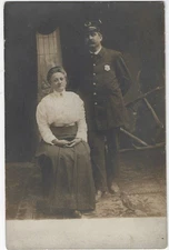 Man Uniform Hat Badge Mustache Woman Vintage RPPC Photo Postcard