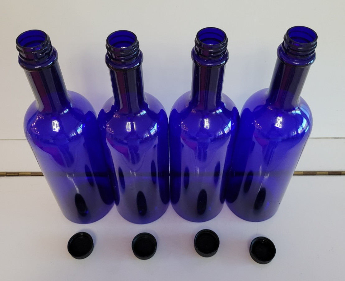 4 COBALT BLUE PLASTIC BOTTLES WITH BLACK PLASTIC LIDS 11 INCHES HOLDS 28 OZS