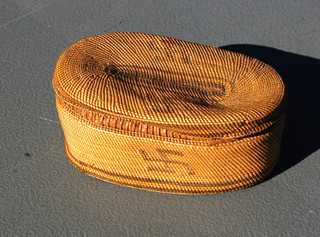 Nice lidded Makah Nootka whirling log design basket. Northwest Pacific