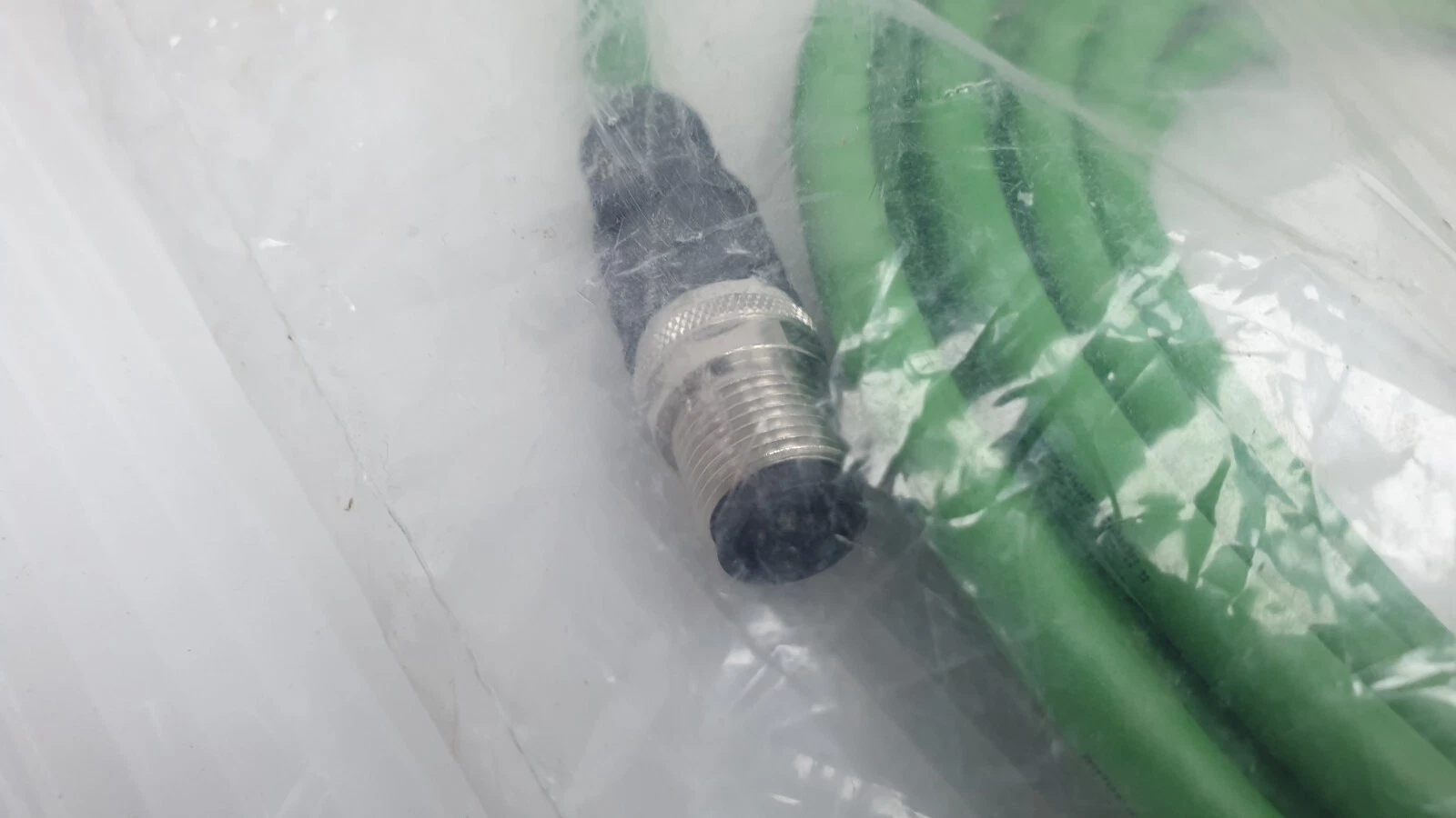 Close-up of the M12 plug on the B&R X67CA0E61.0050 green PUR cable