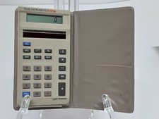 Texas Instruments TI-1706 Vintage Solar Calculator with Tan Wallet Case Tan