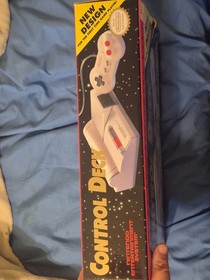 Classic NES game console. 2 controllers and NES advantage in box with packaging