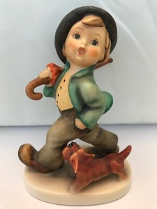 hummel boy with umbrella and dog