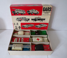 SIX ASSORTED TIN PLATE FRICTION DRIVE CARS NEAR MINT BOXED