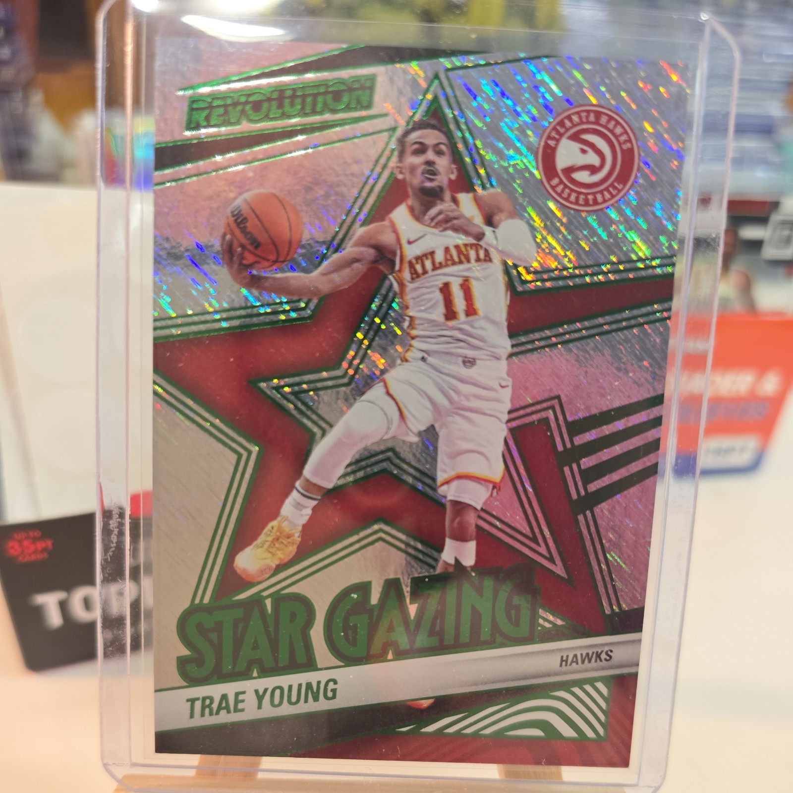 2024-25 Panini Revolution TRAE YOUNG #/99 GREEN STORM Star Gazing Hawks 8