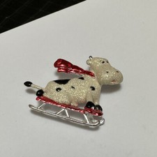 Signed Dancraft Christmas Holiday Brooch Pin Silver Tone Glitter Cow On A Sled