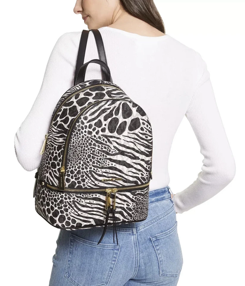 Mochila mediana Michael Kors Rhea negra blanca MK Signature Zebra, bolso escolar
