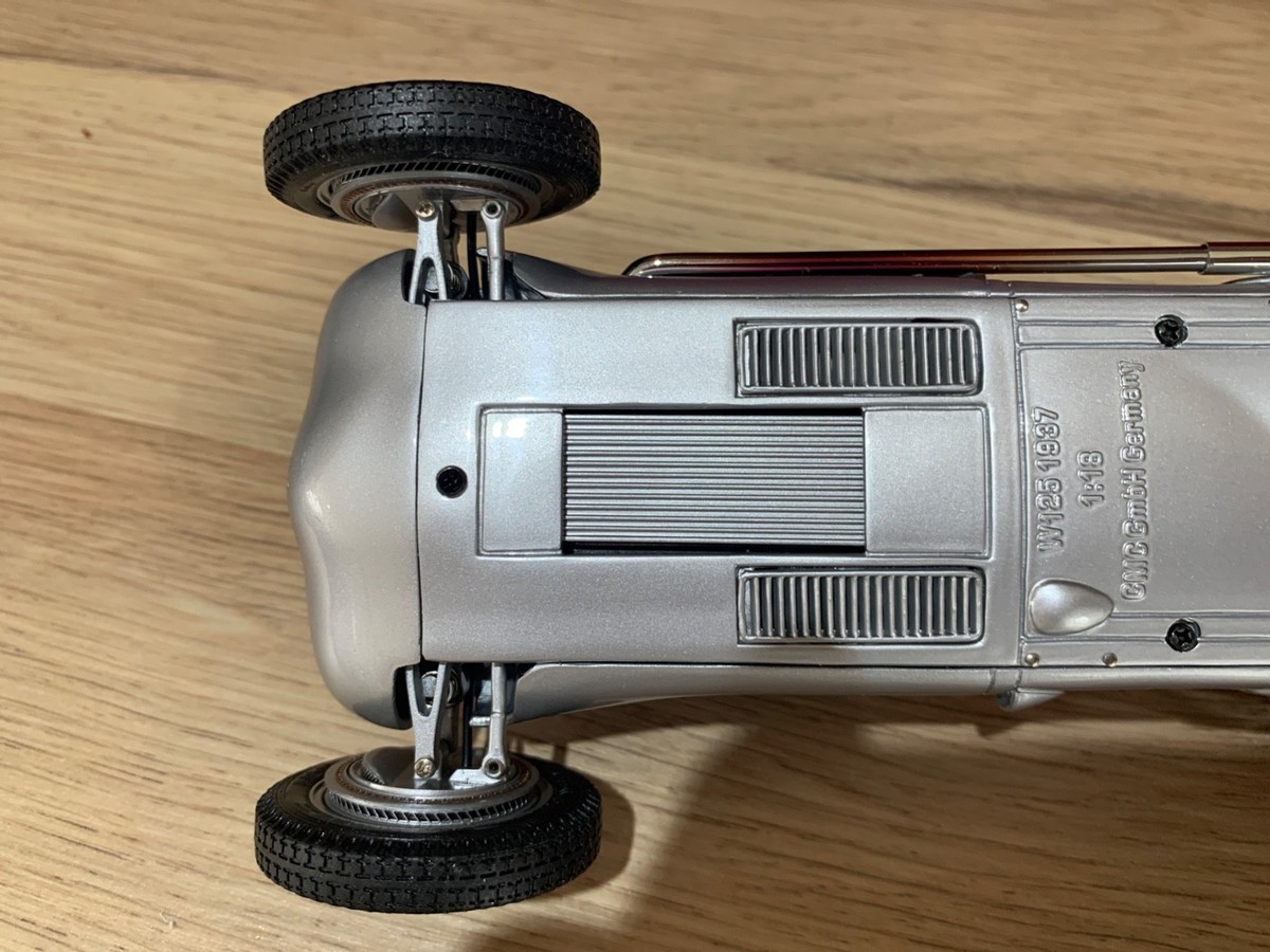Auctions | CMC 1/18th scale M-052 Mercedes Benz W125 1937 - silver, blue interior, racing number 12 Excellent Plus (small scratch to rear) with accessory