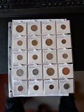 lot of world coins in coin holders
