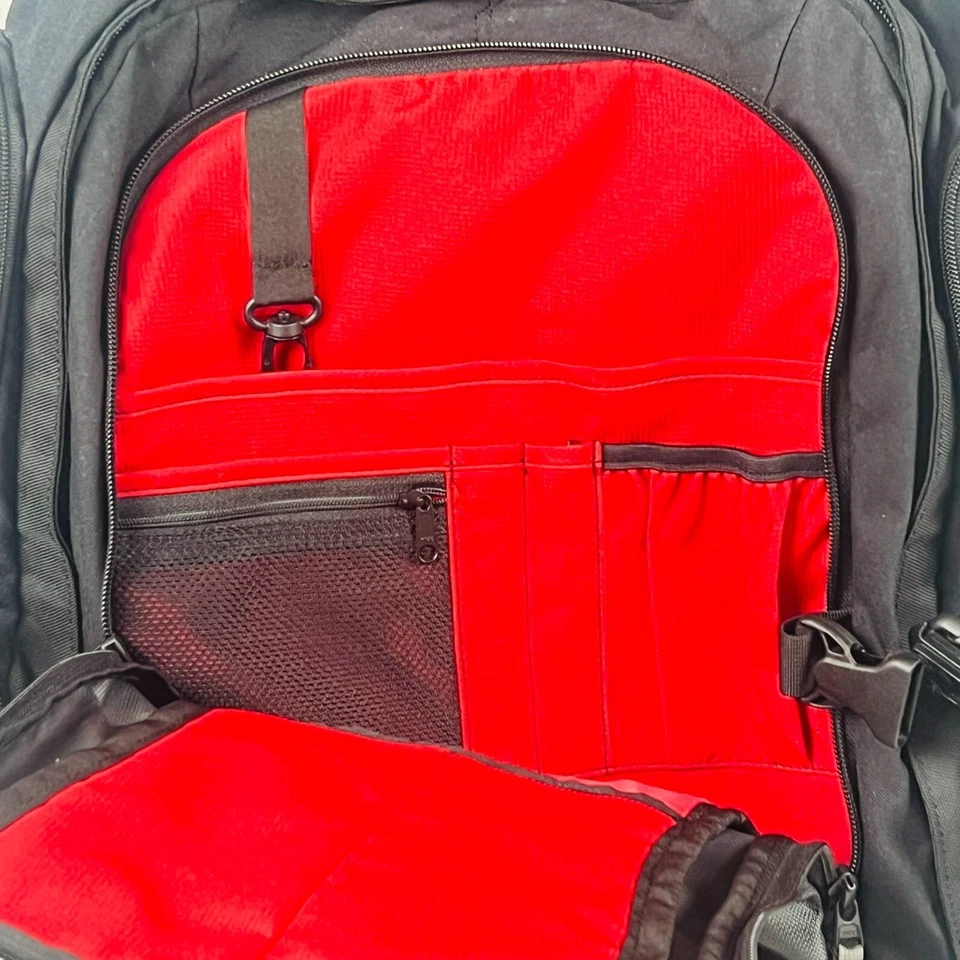 Mochila de equipaje de viaje con ruedas Eagle Creek negra y gris con varios compartimentos Foto 3 de 4