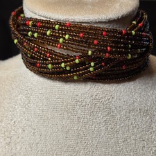 Brown Multi-strand Beaded Cuff Bracelet With Bright Red And Green Accents