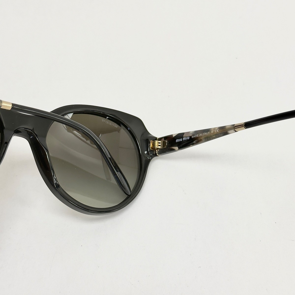 MIU MIU 06P Black Sand Marble Butterfly Geometric Fashion