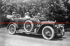 F004598 Men and women sitting in a Napier car 1920