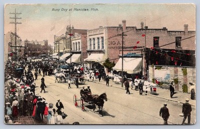 K58/ Manistee Michigan Postcard c1910 Busy Day Main Street Stores 467