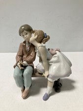 Lladro Porcelain Ten & Growing #7635 Young Girl Kissing Shy Boy on Park Bench