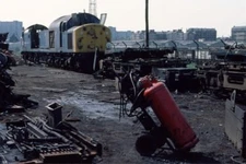 PHOTO  THE SCRAP LINE OF ST ROLLOX WORKS WITH CLASS 40 40072 1978