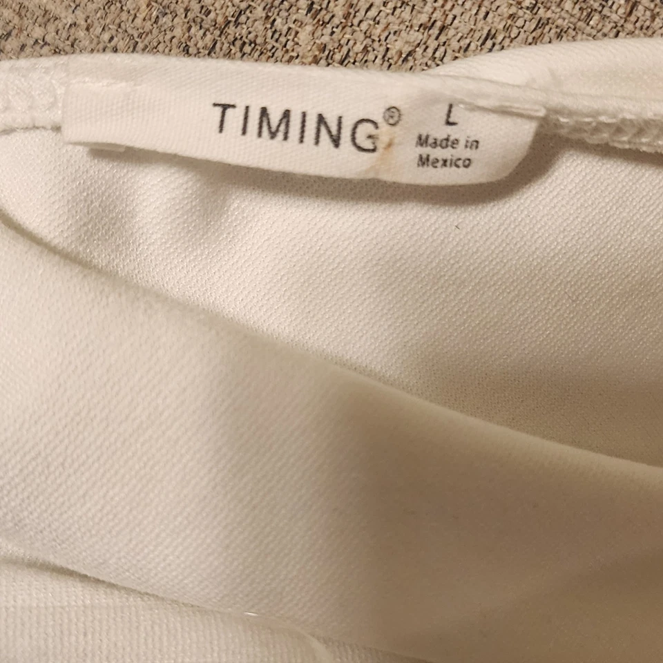 Camisa Timing de manga larga blanca grande de una pieza para mujer Foto 3 de 3