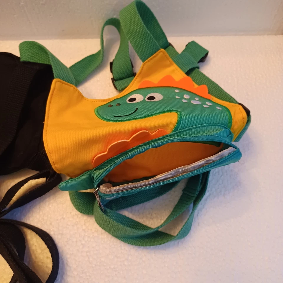 (2) ea. Arnés de seguridad para niños. Personajes de dinosaurio verde, 1 negro y otro amarillo. Foto 3 de 3