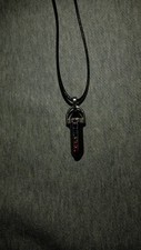 A Beautiful Obsidian Pendant Necklace On Black Rope