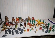 Large Toy Dinosaur lot including big and small dinosaurs, rocks, trees, volcano