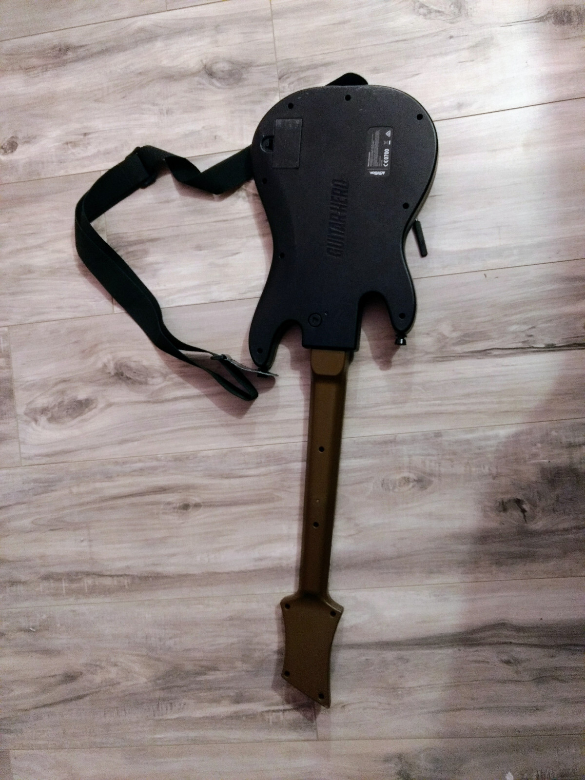 Used black Guitar Hero controller Hero Power Guitar Model 0000654. No