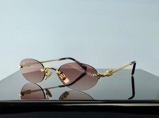 Miu Miu Logo SMU A54S ZVN70O Gold / Pink Lens Round Sunglasses 100 UV