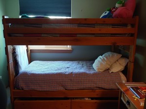 wooden bunk beds with mattresses