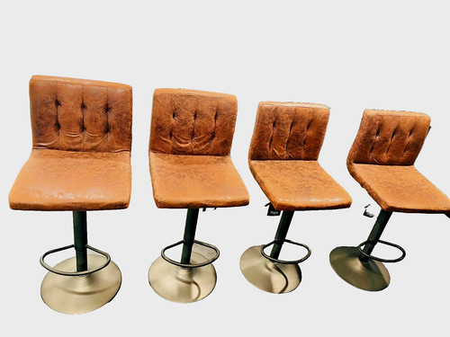 set of four modern adjustable swivel bar stools with faux leather upholstery