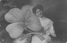 1908 Lady with Huge 4 Leaf Clover - Exaggeration Real Photo Postcard/RPPC