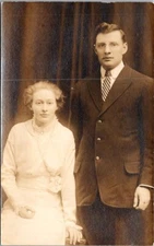Pretty Lady and Man Pose in Studio Real Photo RPPC postcard