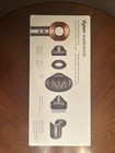 Brand new. Never opened. Dyson supersonic hair dryer