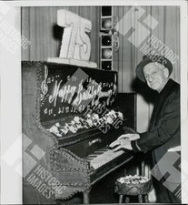 1968 Jimmy Durante playing a piano made of cake at his 75th birthday party