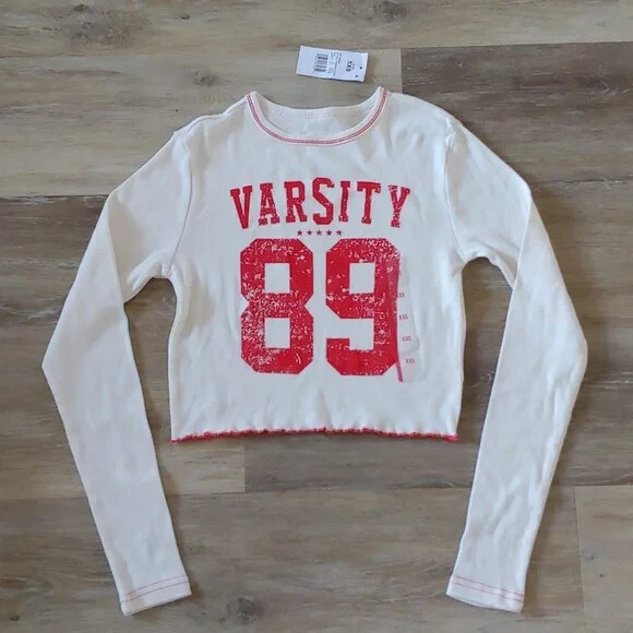 NWT Modern Lux Women's Varsity Graphic Long Sleeve Crop Top Ivory Size XXS