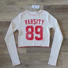 NWT Modern Lux Women's Varsity Graphic Long Sleeve Crop Top Ivory Size XXS